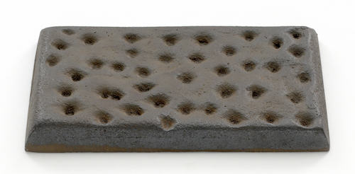 Sculpture by Claes Oldenburg titled Knaeckebroed.