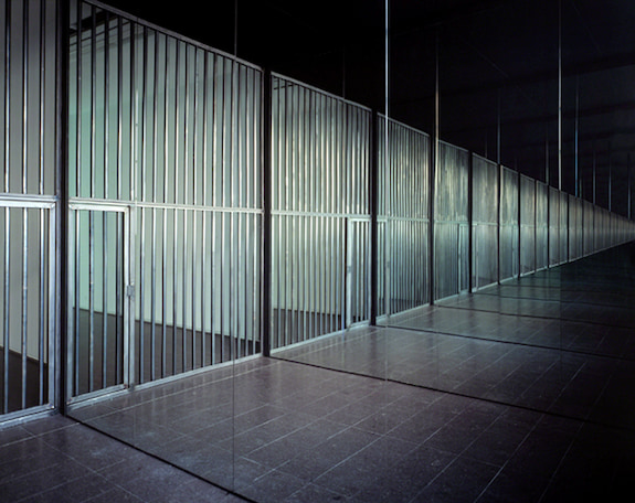 Alfredo Jaar's Infinite Cell (2004) is a combination of mirrors and a single prison cell reflected infinitely.
