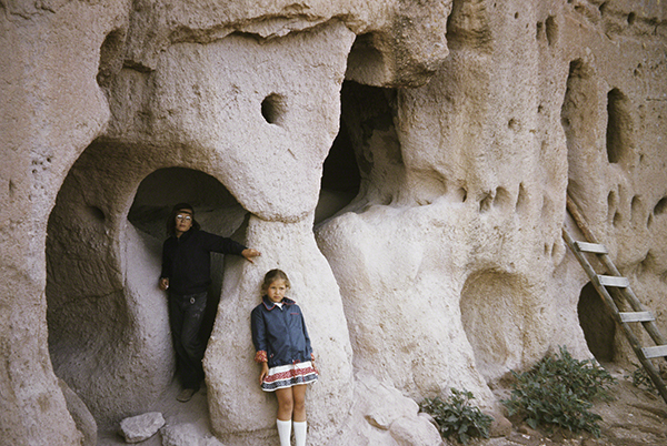 Anasazi culture entrance carved out of the tufa cliffs at Puye Cliff Dwellings, Española, New Mexico (1100s–ca. 1580s). Chambers carved into cliff face with ladder leading to higher entrance.