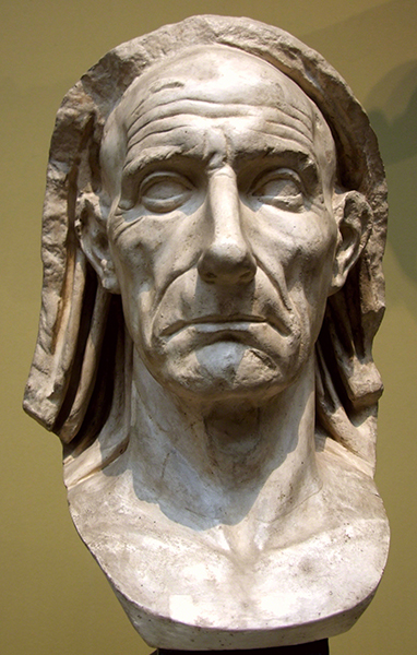 Marble portrait bust from ancient Rome of an older man wearing a veil.