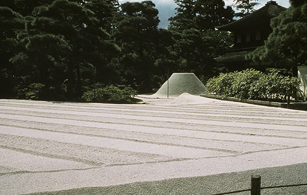 Dry garden designed by Ashikaga Yoshimasa at Ginkakuji Temple. Sand, gravel, and rocks raked in lines (Sea of Silver Sand) with the Moon Viewing Platform mound in the background.