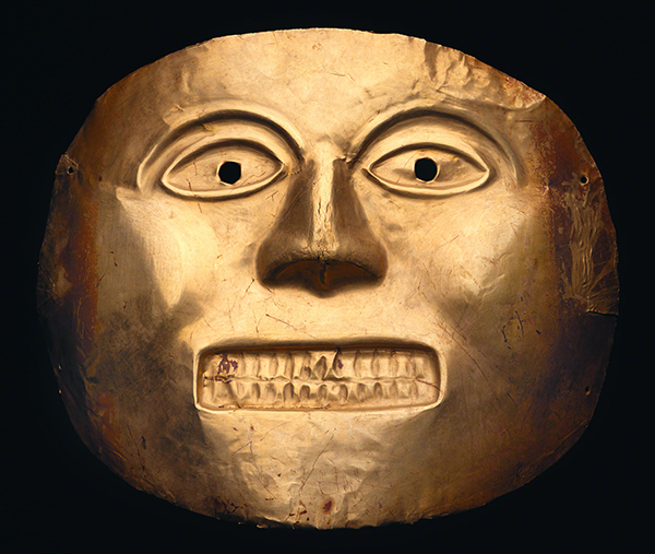 Gold ceremonial mask from the Calima Culture, Colombia (ca. 500 CE). Gold mask of a face with eyes open and teeth bared. 