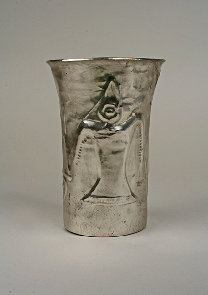 Chimú, Beaker with bird effigy, 1100s–1400s. Silver cup featuring bird with one large eye.