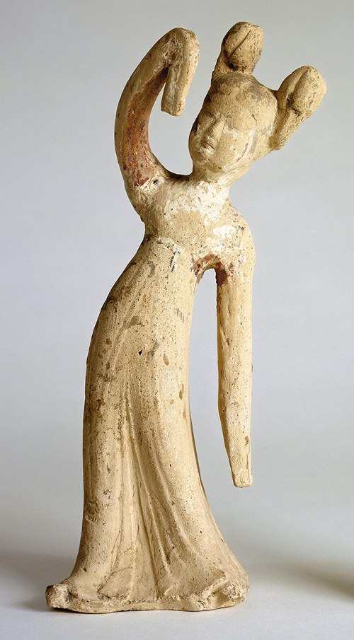 Chinese Tang Dynasty Dancer tomb figure (600s–700s CE). Clay figure of a dancer with one arm raised.