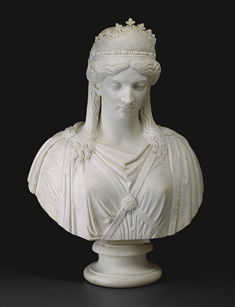 Marble sculpture by Harriet Hosmer titled Zenobia, Queen of Palmyra (ca.1857). Bust of a women wearing a crown and draped clothes with her eyes cast downward.