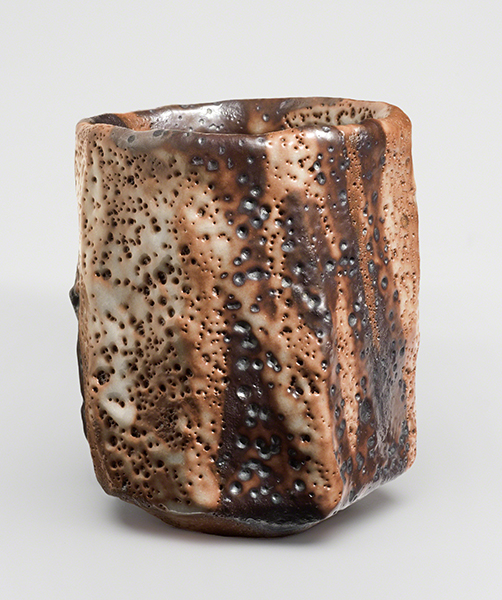 Shino ware teal bowl by Hidetoshi Kōchi (ca. 2005). Ceramic tea bowl with cream, brown, and orange pocked glaze.