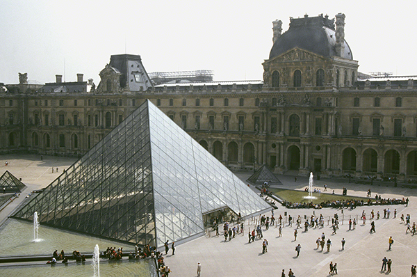 Structure designed by I. M. Pei titled the Louvre Pyramid (1984–1988). Glass pyramid in front of the Louvre in Paris.