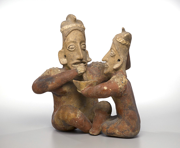 Ceramic figures from the Jalisco Culture (ca. 100 BCE to 300 CE). Seated figures, one holding a bowl of food and the other eating from the bowl.