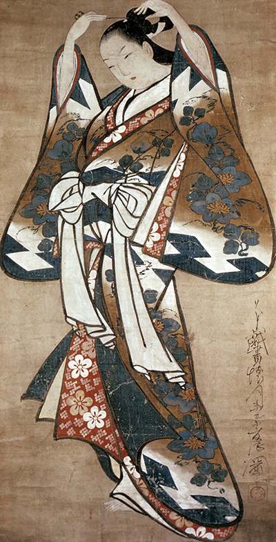 Painting by Kaigetsudō Doshin titled Woman Placing Hairpin in Her Hair (ca. 1715). Standing female figure wearing layers of floral kimonos placing a hairpin in her hair.
