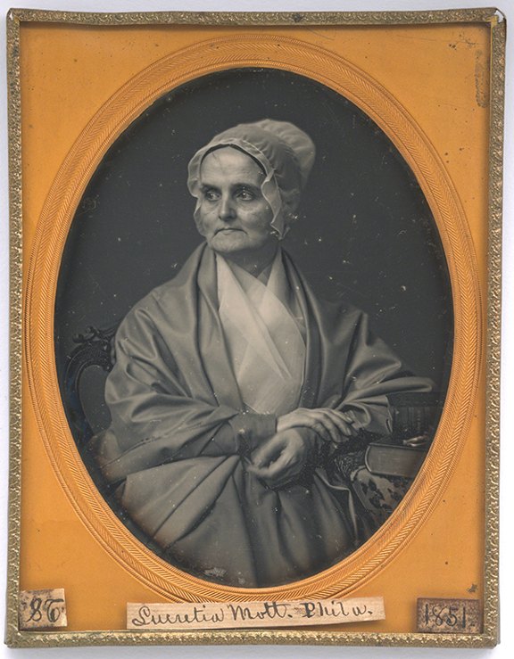 Daguerreotype by Marcus Aurelius Root of Lucretia Coffin Mott (1851). Black-and-white photograph of a woman in a shawl and bonnet.