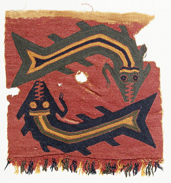 Proto-Nazca (Curvilinear) or Paracas Necropolis textile fragment (200-600 CE). A green fish with teeth and one arm above a black fish with teeth and one arm on a red background.