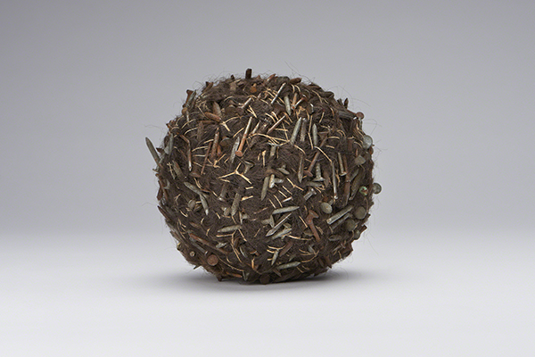 Sculpture by Nick Cave titled Furballs #1 (ca. 1995). Spherical sculpture made from hair, twine, and nails.