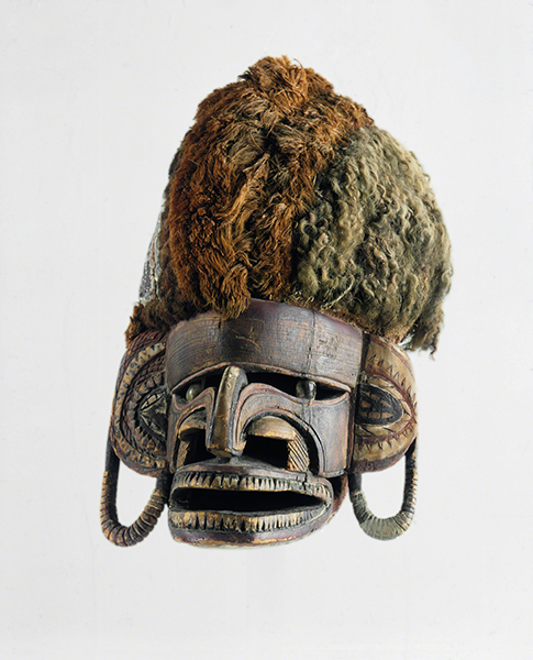 Papua New Guinea, New Ireland Province, Malagan Mask, late 1800s/early 1900s. Malagan mask with carved wood face with stylized features and fiber hair.