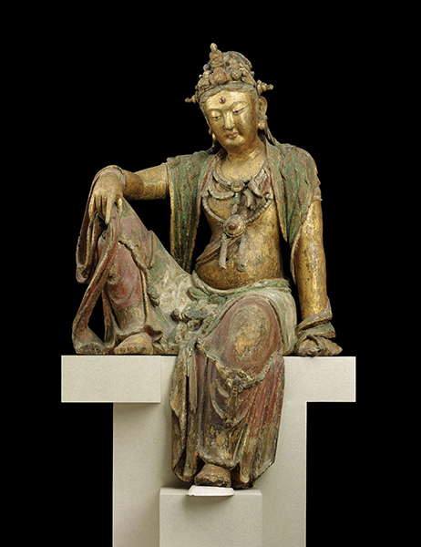 Sculpture from the Song dynasty, China, of a Guanyin (1100s). Seated figure of Guanyin in the position of royal ease (right hand on bent knee) in gold, red, and green. 
