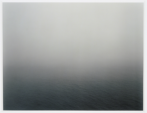 Photograph by Hiroshi Sugimoto titled North Pacific Ocean, Mount Tamalpais (1994). Black-and-white photograph of the ocean with thick fog above.