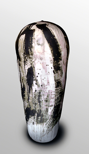Glazed stoneware sculpture by Toshiko Takaezu titled Li-Mu (Seaweed) (1993). Elongated, enclosed vase form with white background and black brushstrokes and splatter.