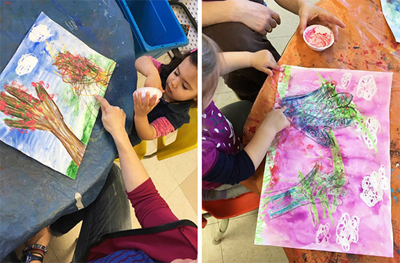 Left: Lauralie and her mother, Karine, painting together. Right: Julia and her mother, Monica, collaborate on their painting.