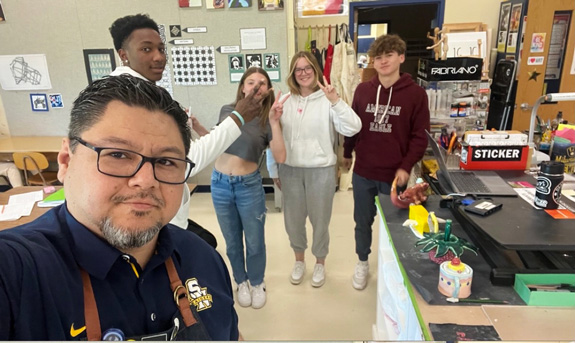 A progression triptych featuring Frank Juárez and his homeroom students, with photographs taken annually from sophomore year through graduation.