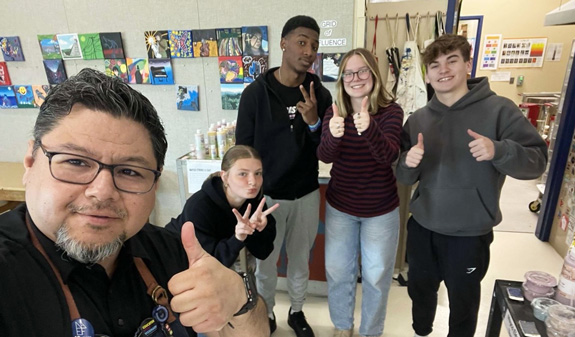 A progression triptych featuring Frank Juárez and his homeroom students, with photographs taken annually from sophomore year through graduation.