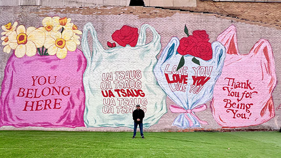Frank with the mural Thankful by Lindsey Cherek Waller in downtown Wausau, Wisconsin