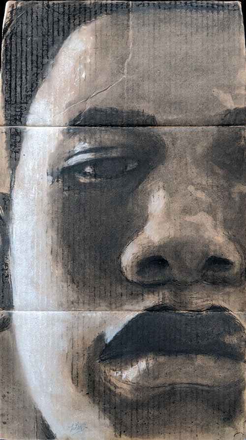 Student artwork from Charcoal Cardboard Self-Portraits, a High School art lesson