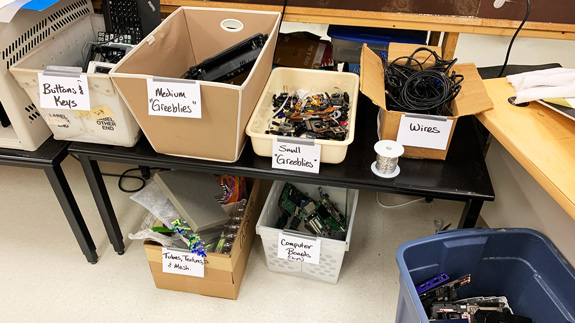 Disassembled computer parts and other items ready for exploration