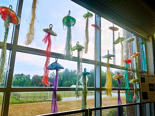 The sculptures that were returned to the school after the festival got a second life in a well-lit stairwell.