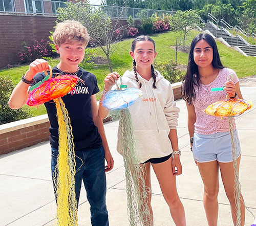 Ethan S., Madeline L., and Kashika P. with jellyfish.