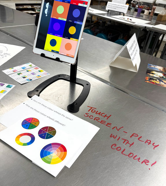 Students and families engage with digital and analog activities that invite open-ended discovery of color.