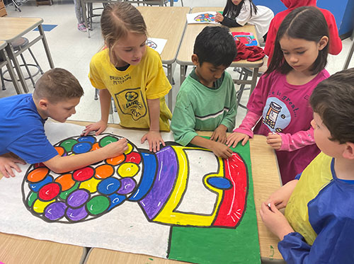 Students add finishing touches to a Wayne Thiebaud–inspired gumball machine.