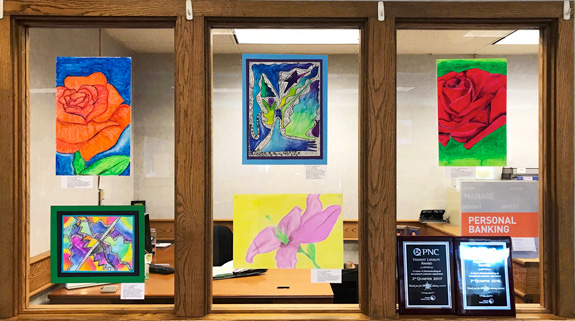 Student artwork on display at the local bank.