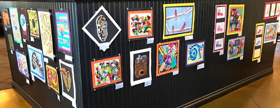 Student work exhibited inside a popular local restaurant.