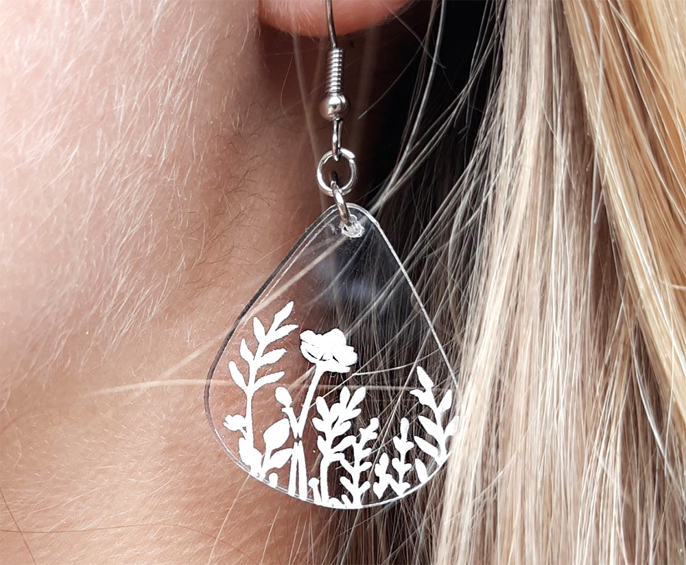Student artwork of an earring featured in the middle-school art lesson about laser-cutter design.