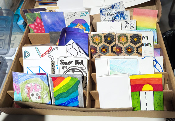 A mix of student- and teacher-created trading cards.