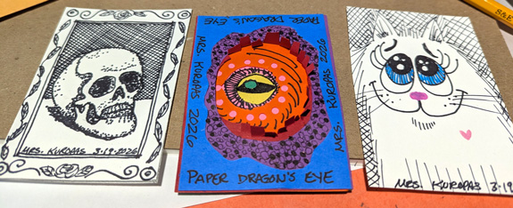 Patty Kuropas (art teacher), Skull, Dragonʼs Eye, and Cat, mixed media.