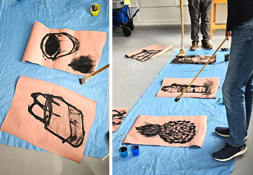 Elementary students use large brushes and ink to paint objects from the article, Redrawing the Classroom as a Model of Mindfulness.