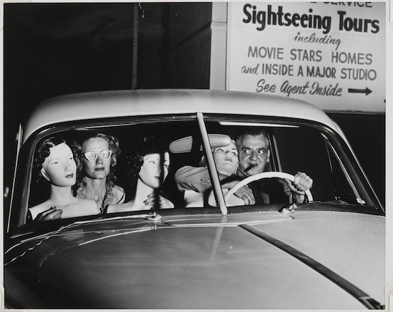 Photograph by Weegee titled "Self-Portrait with Mannequins"